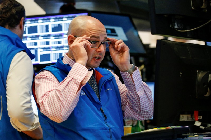 A specialist trader works at his post on the floor of the NYSE in New York