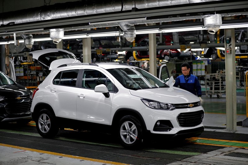 FILE PHOTO: An employee works at an assembly line of GM Korea's Bupyeong plant in Incheon