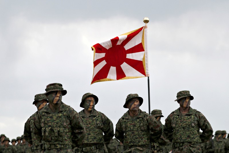 Soldiers of Japanese Ground Self-Defense Force (JGSDF)'s Amphibious Rapid Deployment Brigade, Japan's first marine unit since World War Two, gather at a ceremony activating the brigade at JGSDF's Camp Ainoura in Sasebo