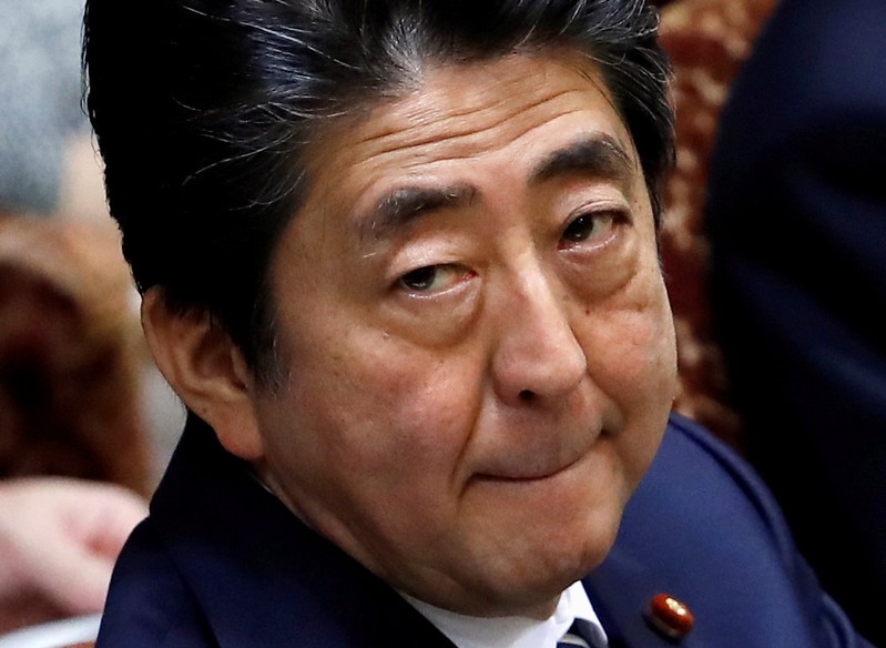 FILE PHOTO: Japan's Prime Minister Shinzo Abe at an upper house parliamentary session in Tokyo