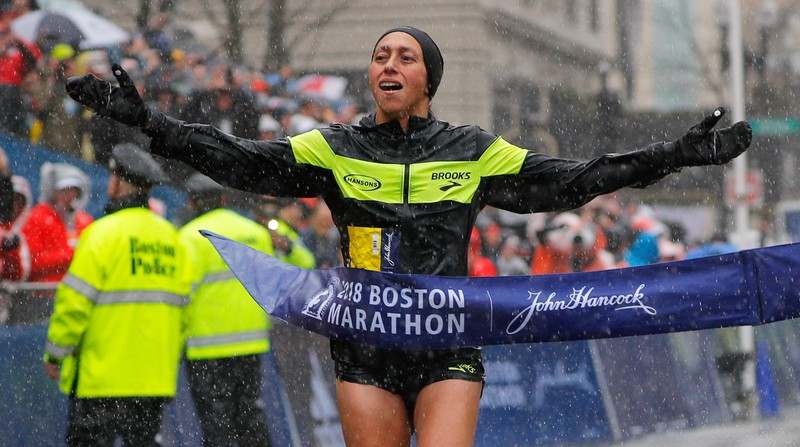 Desiree Linden of the U.S. crosses the finish line to win the women's division of the 122nd Boston Marathon in Boston
