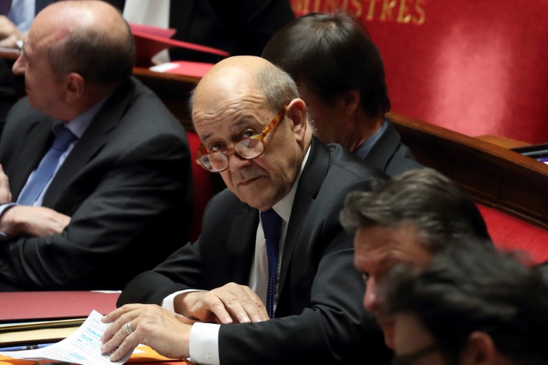 French Foreign Affairs Minister Jean-Yves Le Drian attends the questions to the government session at the National Assembly in Paris