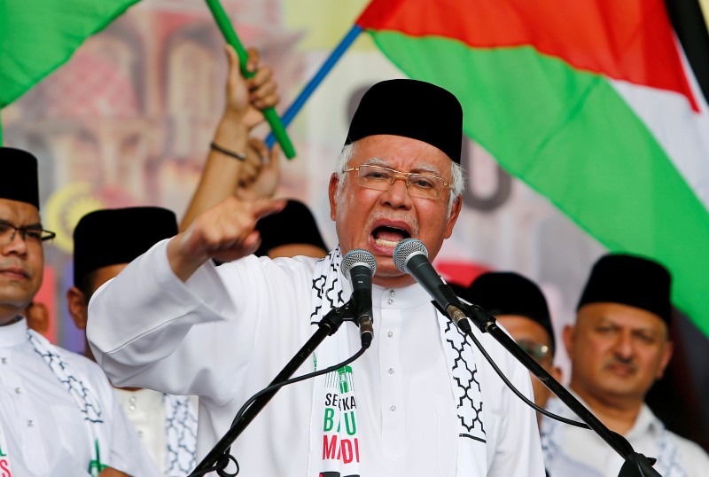 Malaysia's Prime Minister Najib Razak gestures as he speaks during a rally against U.S. President Donald Trump's decision to recognise Jerusalem as the capital of Israel, in Putrajaya