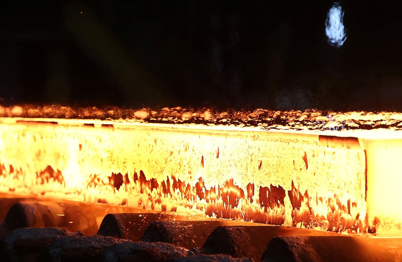 FILE PHOTO: A slab of steel rolls down the line at the Novolipetsk Steel PAO steel mill in Farrell, Pennsylvania