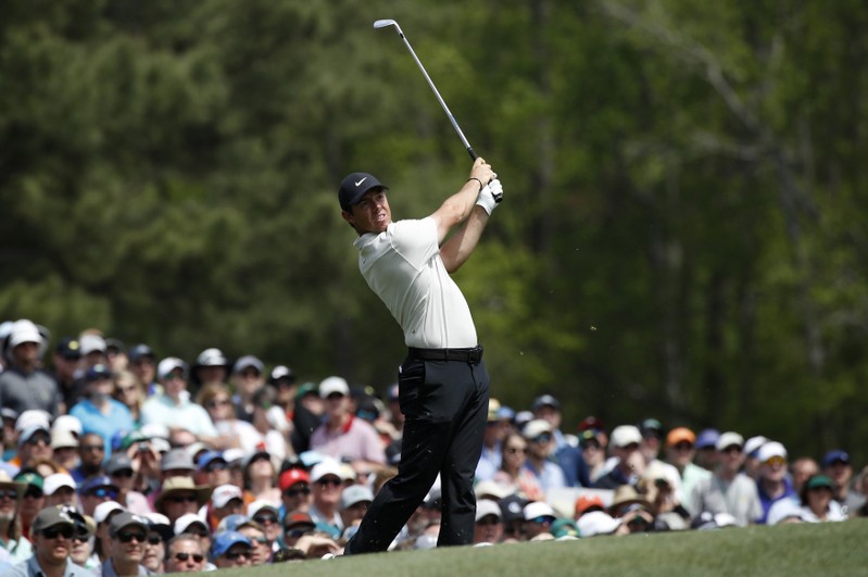 Rory McIlroy of Northern Ireland hits off the 12th tee during second round play at the 2018 Masters golf tournament in Augusta