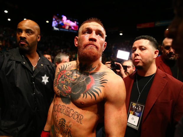 MMA fighter Conor McGregor in NYPD custody after bus attack, police say