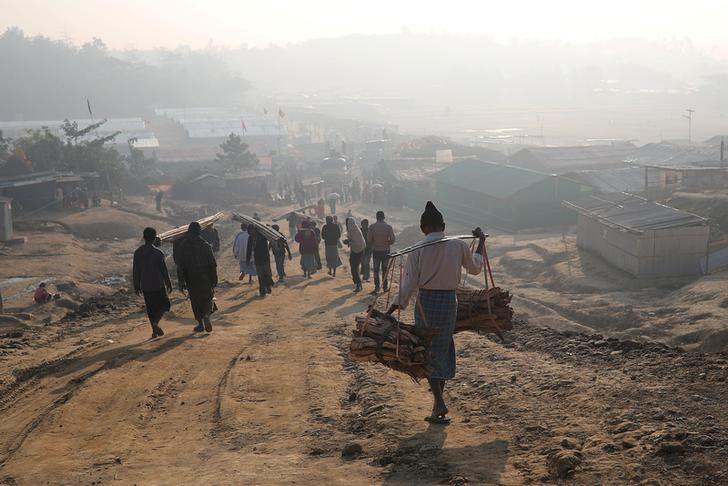 Rohingya refugees walk at Jamtoli camp in the morning in Cox's Bazar