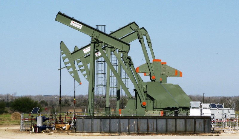 FILE PHOTO - A pump jack used to help lift crude oil from a well in South Texas’ Eagle Ford Shale formation stands idle in Dewitt County Texas