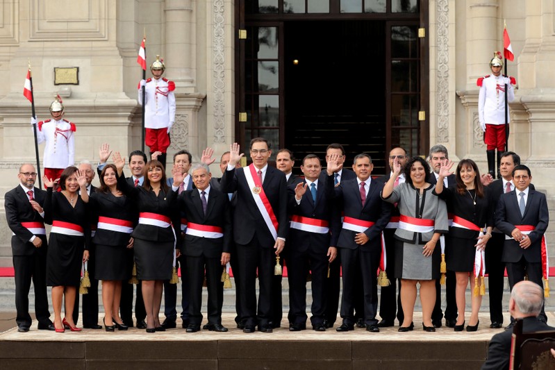 Peru's President Martin Vizcarra and new ministers pose for a picture during the swearing-in ceremony at the government palace in Lima, Peru