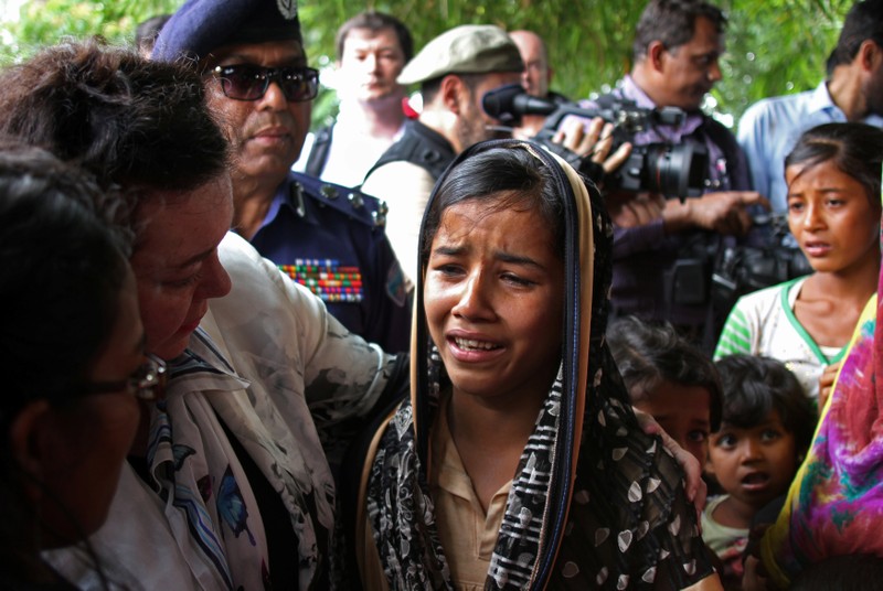 British United Nations Ambassador Karen Pierce consoles a twelve-year-old Rohingya refugee near Cox’s Bazar, in Bangladesh
