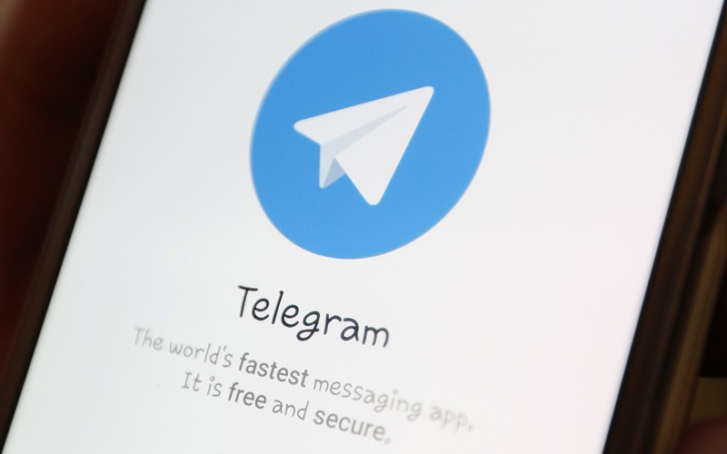The Telegram logo is seen on a screen of a smartphone in this picture illustration