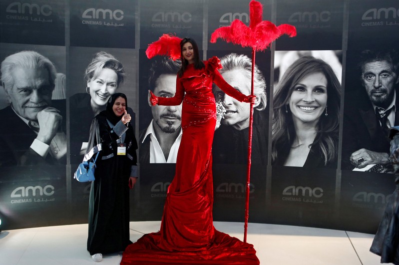 A woman poses at a cinema in Riyadh