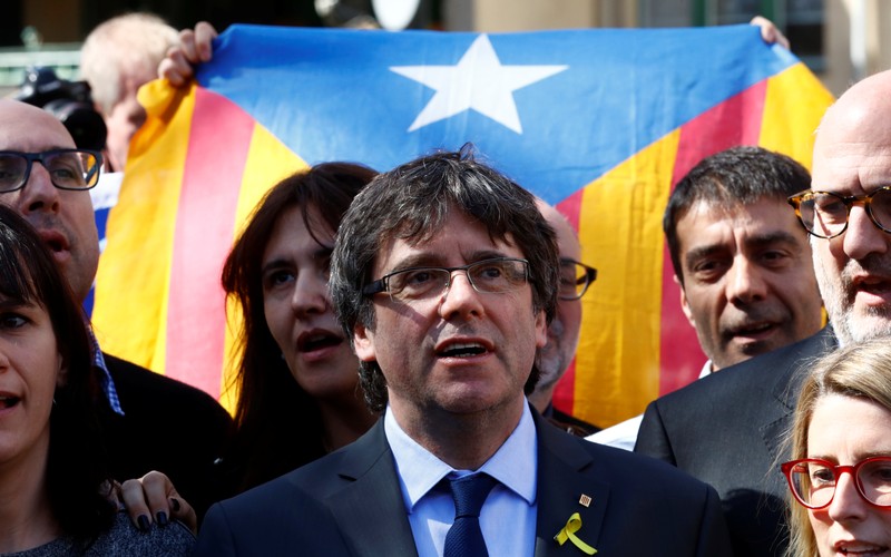 Catalonia's former leader Carles Puigdemont addresses a news conference in Berlin