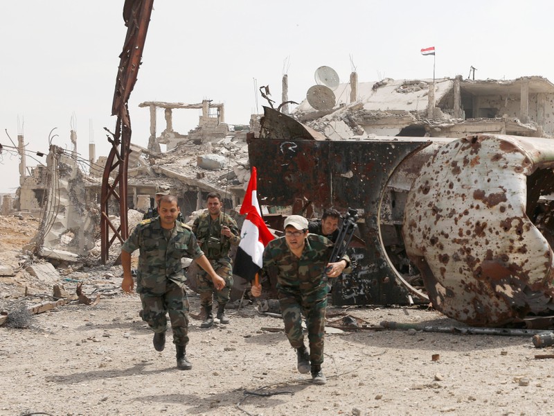 Soldiers loyal to Syria's President Bashar al-Assad forces are deployed at al-Qadam area near Yarmouk Palestinian camp in Damascus