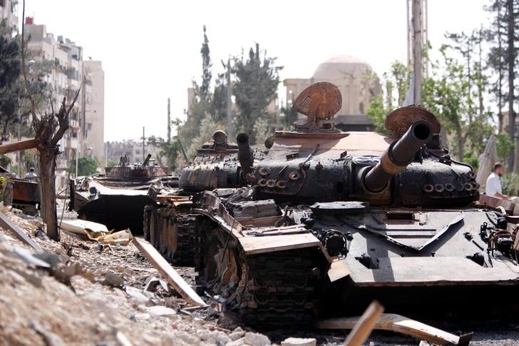 A damaged military vehicle is seen at the city of Douma in Damascus