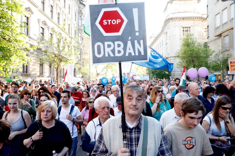 People attend a protest against the government of PM Orban in Budapest