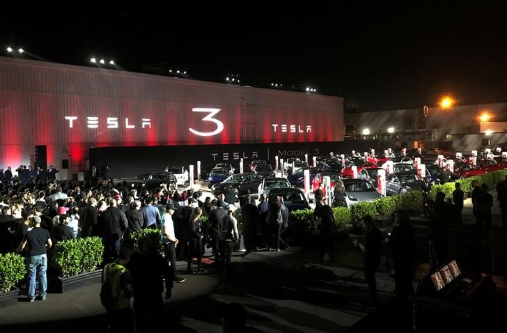 FILE PHOTO: Tesla introduces Model 3 cars off the Fremont factory's production line during an event at the company's facilities in Fremont