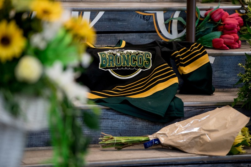 A Humboldt Broncos team jersey is seen among notes and flowers at a memorial for the Humboldt Broncos team leading into the Elgar Petersen Arena in Humboldt, Saskatchewan