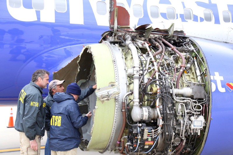 NTSB investigators on scene examining damage to the engine of the Southwest Airlines plane in Philadelphia