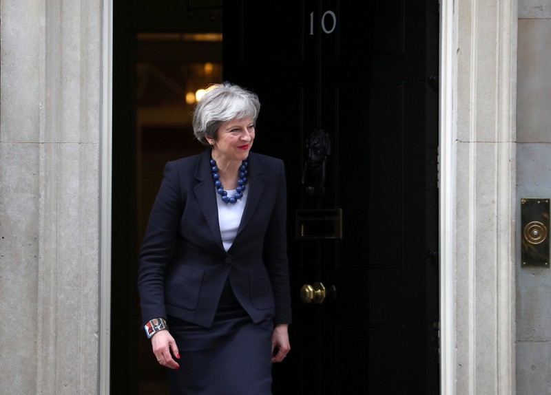 Britain's Prime Minister Theresa May walks out of 10 Downing Street to greet Portugal's Prime Minister Antonio Costa in London