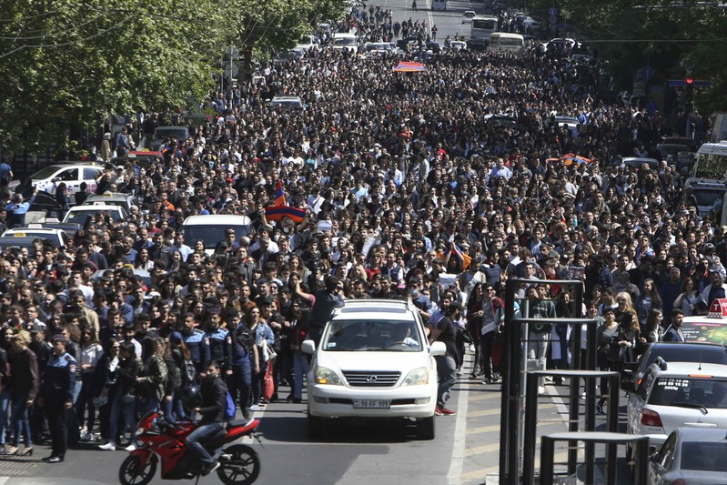 People march during a protest against the appointment of ex-president Serzh Sarksyan as the new prime minister in Yerevan
