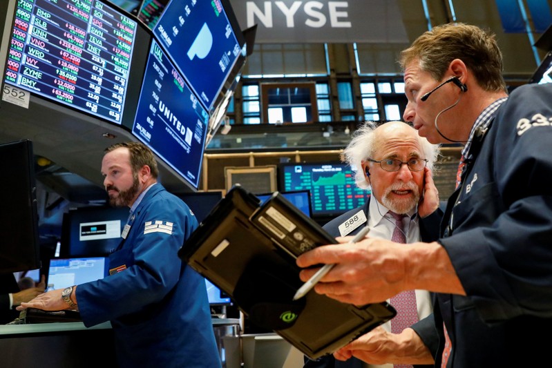 Traders work on the floor of the NYSE in New York