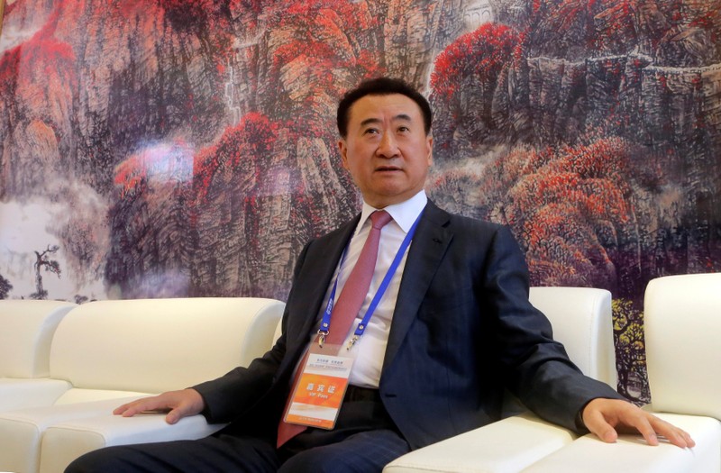 FILE PHOTO: Wang Jianlin, chairman of Chinese property developer Dalian Wanda Group, sits in a meeting room on the outskirts of Qingdao