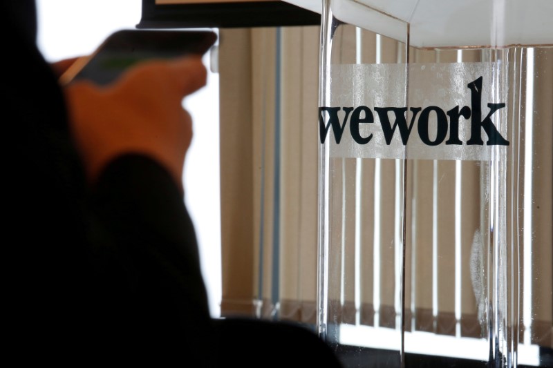 FILE PHOTO: A guest attends the opening ceremony of WeWork Hong Kong flagship location in Hong Kong, China