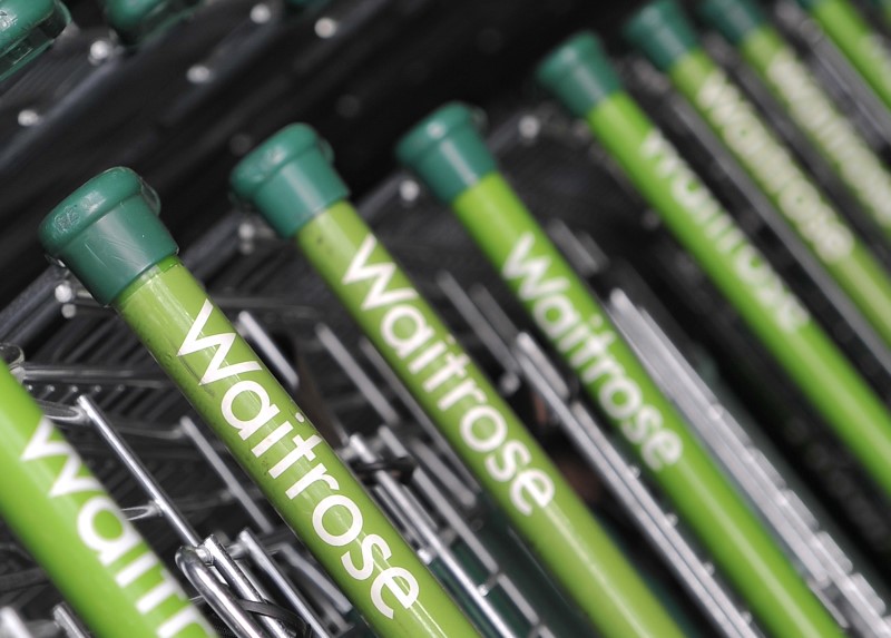 FILE PHOTO: Waitrose shopping carts are seen outside a supermarket in west London