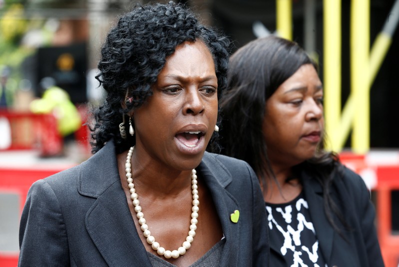 Yvette Williams, repsenting Justice 4 Grenfell and Clarrie Mendy-Solomon, who lost two family members in the disaster, speak outside a commemoration hearing at the opening of the inquiry into the Grenfell Tower disaster, in London