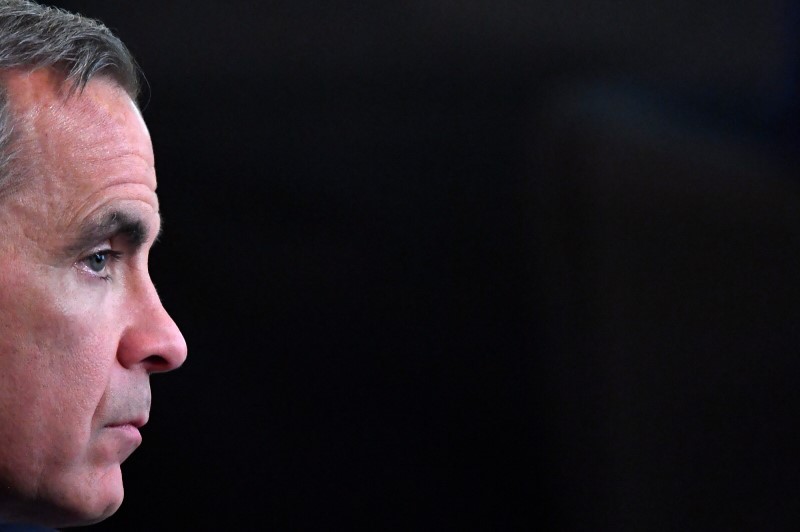 FILE PHOTO: The Governor of the Bank of England, Mark Carney, listens from the audience at an event at the Bank of England in the City of London