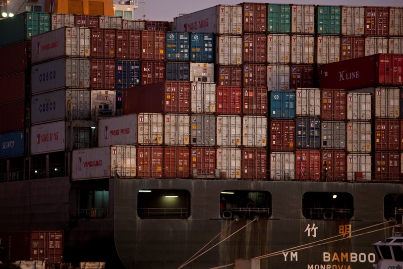 FILE PHOTO: The YM Bamboo, a container ship operated by the China Ocean Shipping Company (COSCO) is docked at the Port of Oakland in Oakland, California