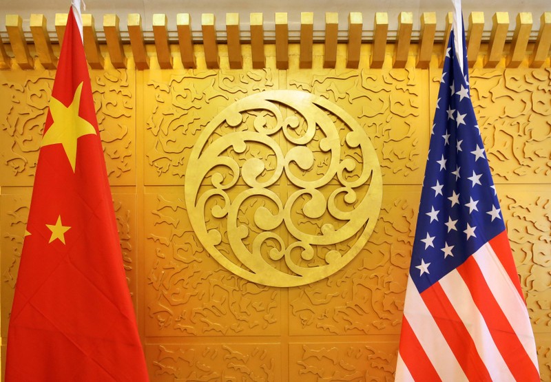 Chinese and U.S. flags are set up for a meeting during a visit by U.S. Secretary of Transportation Elaine Chao at China's Ministry of Transport in Beijing