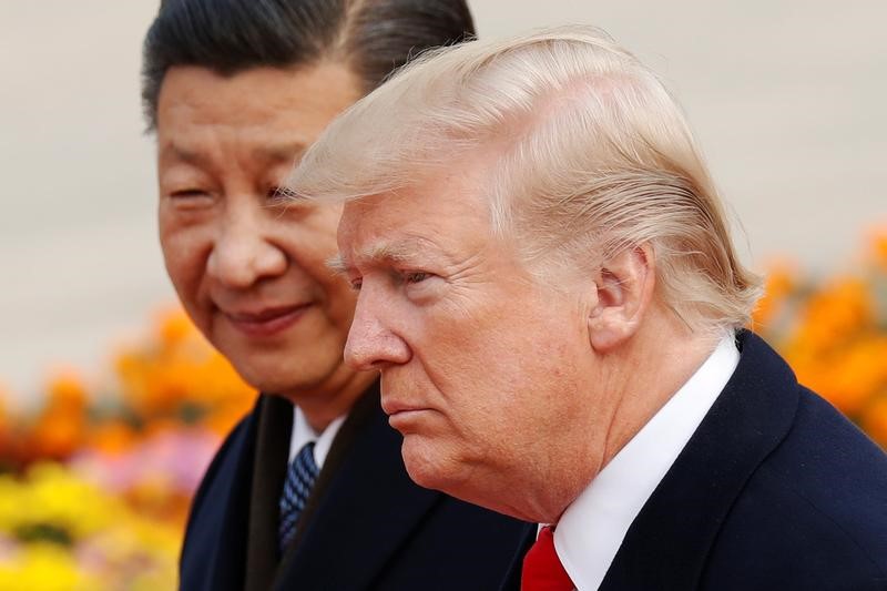 U.S. President Donald Trump takes part in a welcoming ceremony with China's President Xi Jinping in Beijing