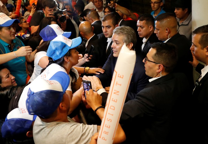 Right wing presidential candidate Ivan Duque greets supporters after polls closed in the first round of the presidential election in Bogota