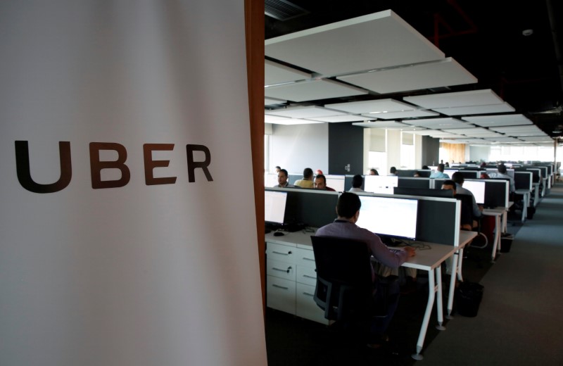 FILE PHOTO: Employees work inside Uber COE in Cairo