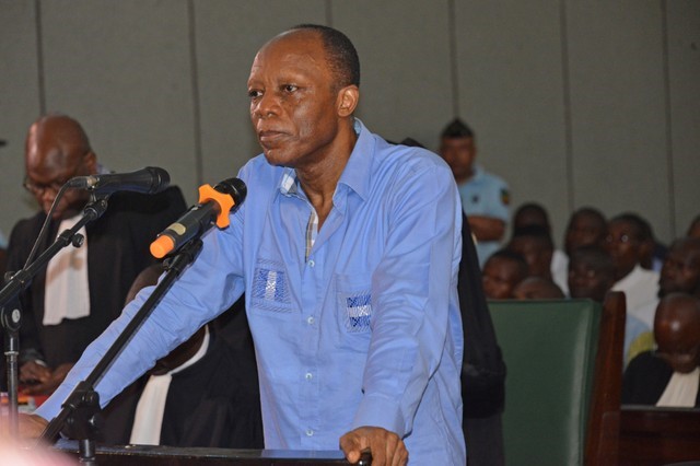 Ex-army chief and opposition presidential candidate Jean-Marie Michel Mokoko stands during his trial at a court in Brazzaville