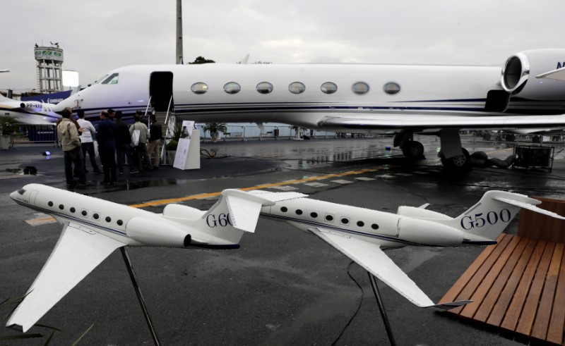 FILE PHOTO: People line up to visit the Gulfstream G550 aircraft during the Latin American Business Aviation Conference & Exhibition fair at Congonhas airport in Sao Paulo