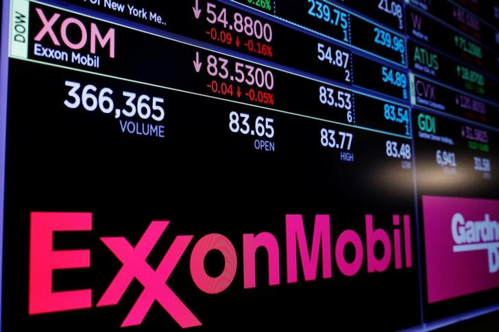 A logo of Exxon Mobil is displayed on a monitor above the floor of the New York Stock Exchange shortly after the opening bell in New York