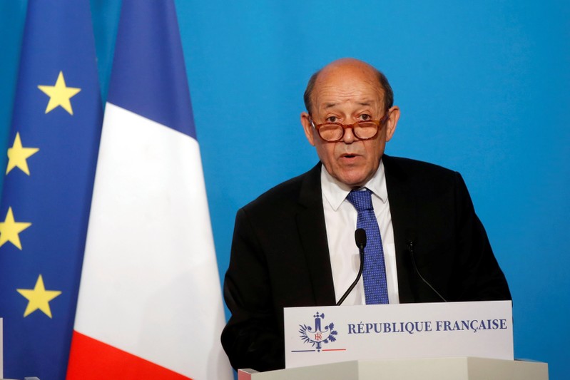 French Minister for Foreign Affairs Jean-Yves Le Drian makes an official statement in the press room at the Elysee Palace in Paris