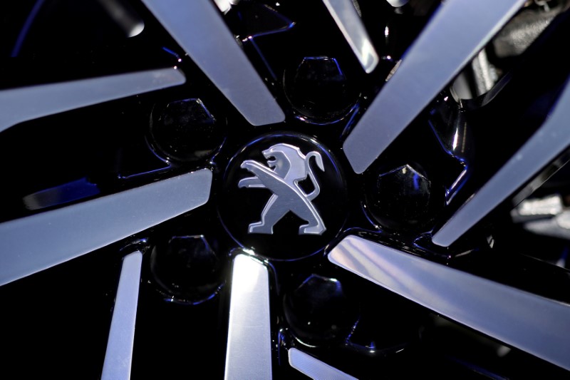 FILE PHOTO: The Peugeot logo is pictured on the new Peugeot 508 before a news conference of PSA Group to announce the company's 2017 annual results at their headquarters