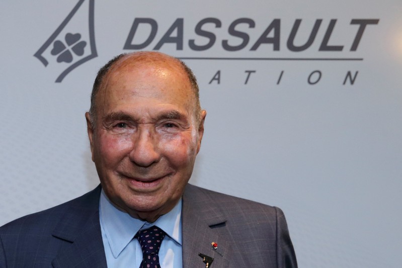 FILE PHOTO: Serge Dassault, French UMP political party member and CEO of Groupe Dassault Holding, poses after the company's 2014 First-Half results presentation in Saint Cloud near Paris
