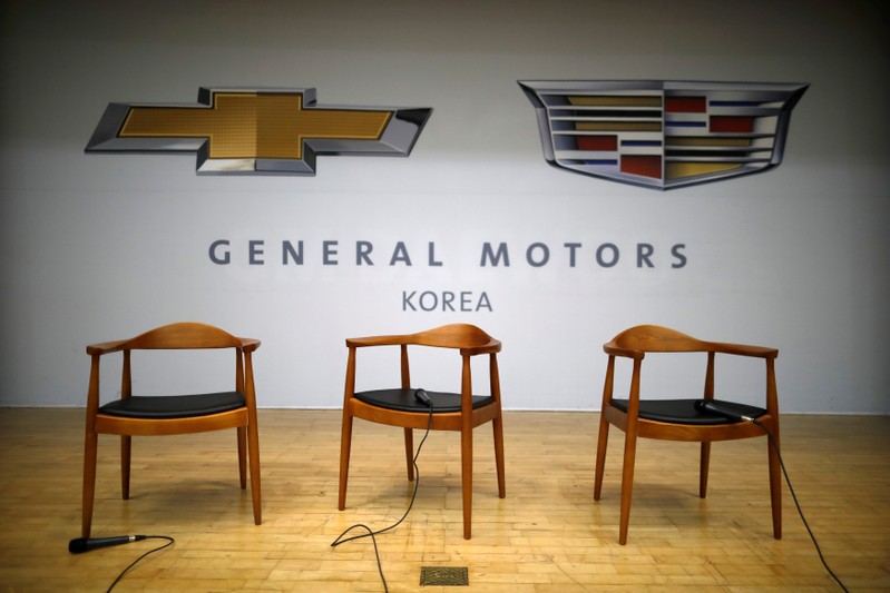 Microphones are seen on chairs for Kaher Kazem, chief executive of GM Korea, and Barry Engle, head of GM's international operations, as a media briefing has been cancelled at a GM Korea's plant in Incheon