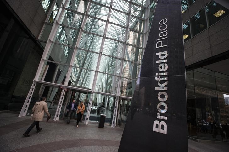 FILE PHOTO: People walk to Brookfield Place off Bay Street on the day of the AGM for Brookfield Asset Management shareholders in Toronto