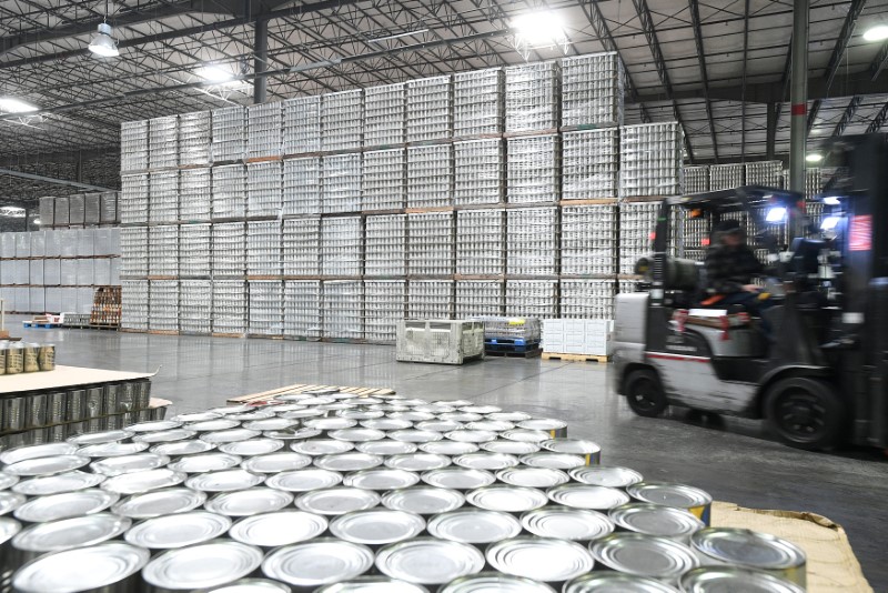 A forklift passes cans at Pacific Coast Producers' distribution center in Lodi, California
