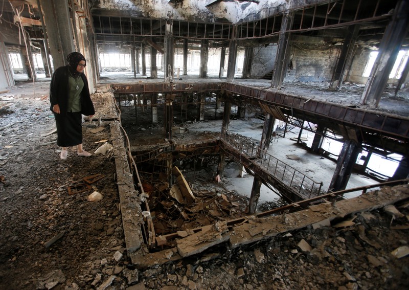 FILE PHOTO: Raghad Hammoudi, who is a member of a group of students campaigning to help rebuild the Central Library of Mosul University, is seen in Mosul