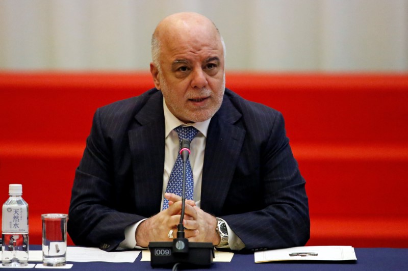 Iraqi PM Haider al-Abadi speaks during the Tokyo Conference on Supporting Job Creation and Vocational Training to Facilitate Weapons Reduction for Iraqi Society in Tokyo