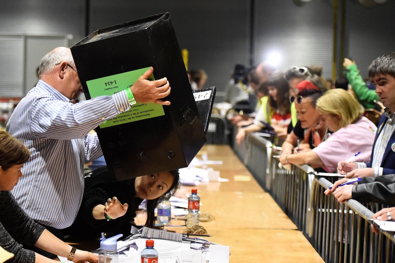 Woman checks underneath a ballot box after the Abortion Referendum in Dublin