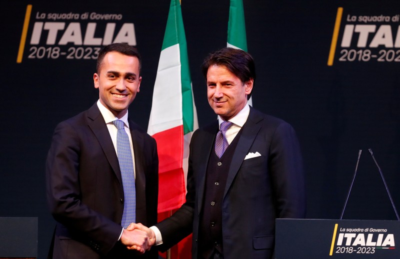 FILE PHOTO: 5-Star Movement leader Di Maio shakes hands with Giuseppe Conte in Rome ahead of Italy's election