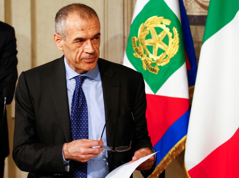 Former senior International Monetary Fund (IMF) official Carlo Cottarelli speaks to the media after a meeting with Italy's President Sergio Mattarella at the Quirinal Palace in Rome